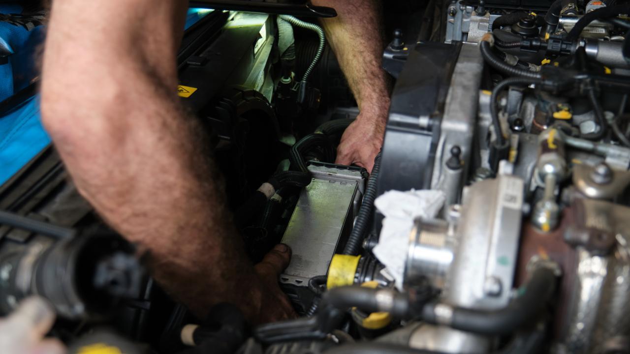 Man Installing Intercooler Bolt On Performance Upgrade