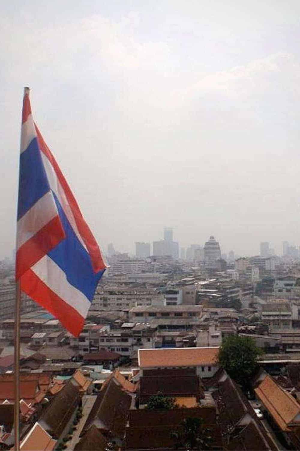 The Thai flag with a city view