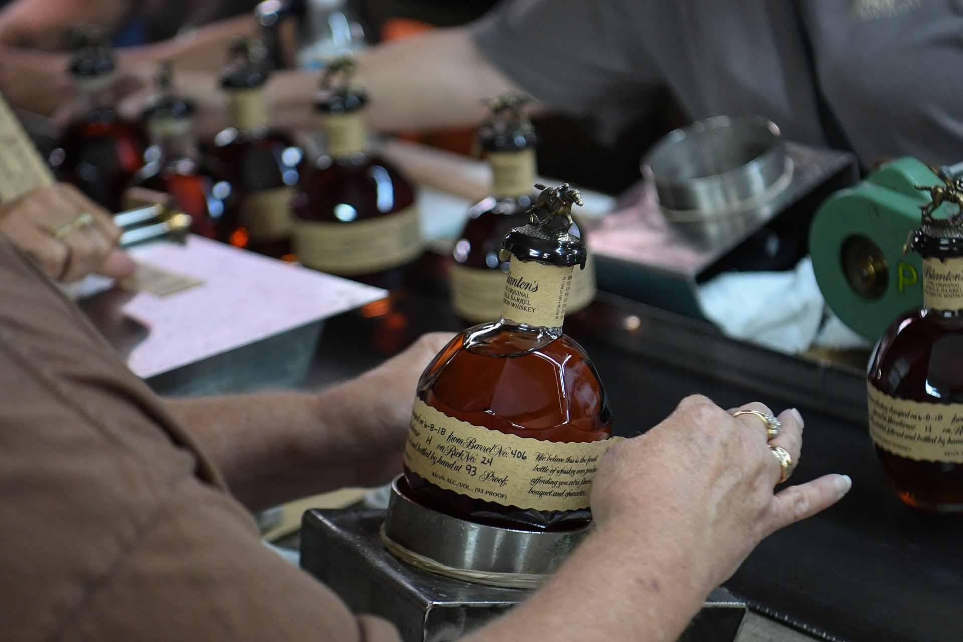 Allocated bourbon can be difficult to find. Worker prepares it in factory.