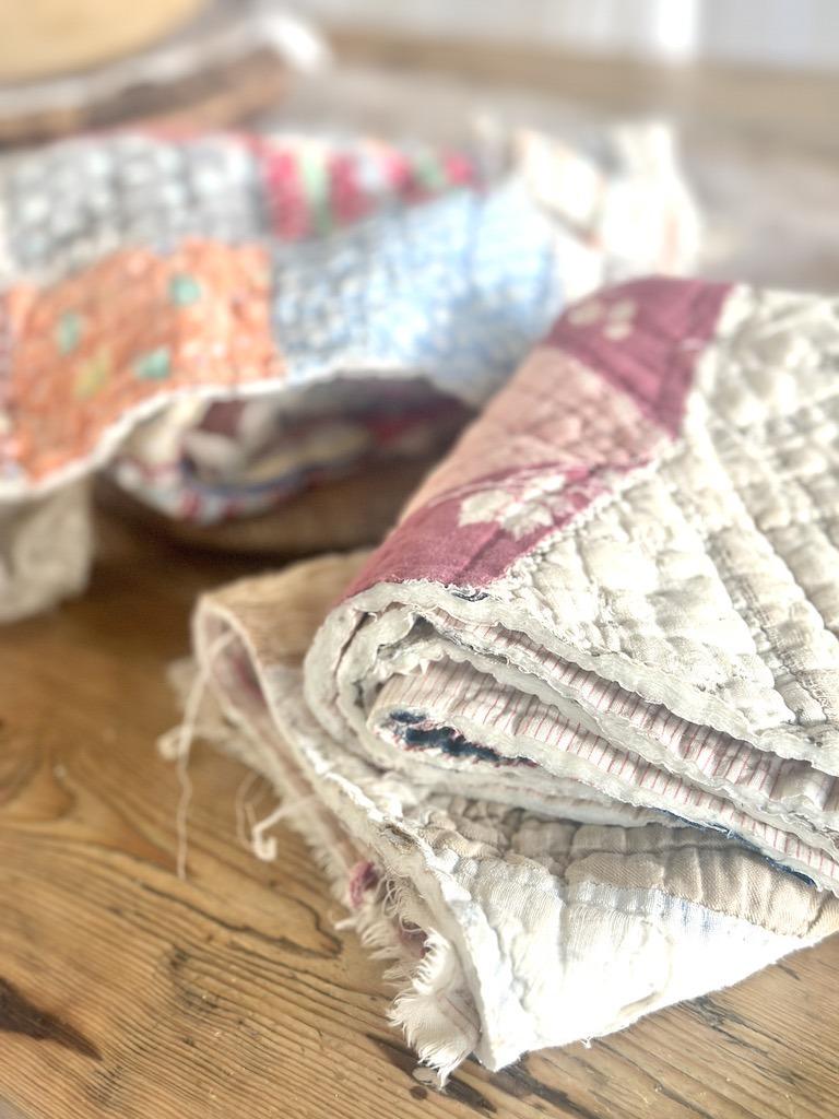 worn vintage quilts