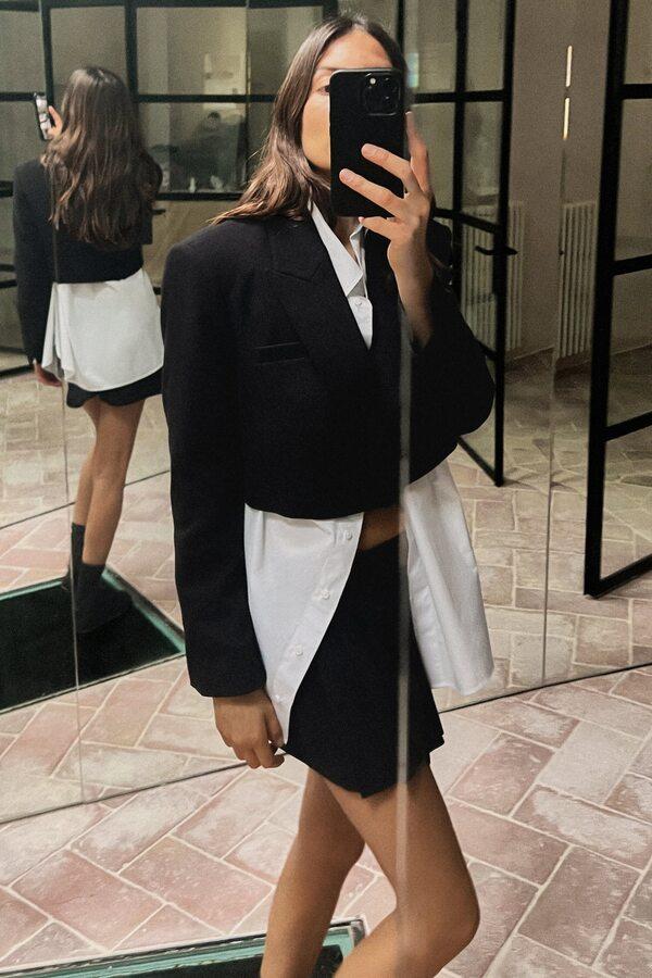 Zara model wearing black skirt and top