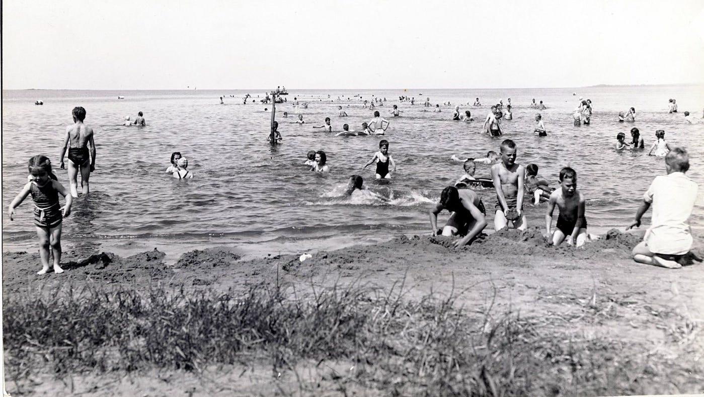 Before pollution closed the beach in the 1940s, people would flock to Bay Beach on hot summer days.