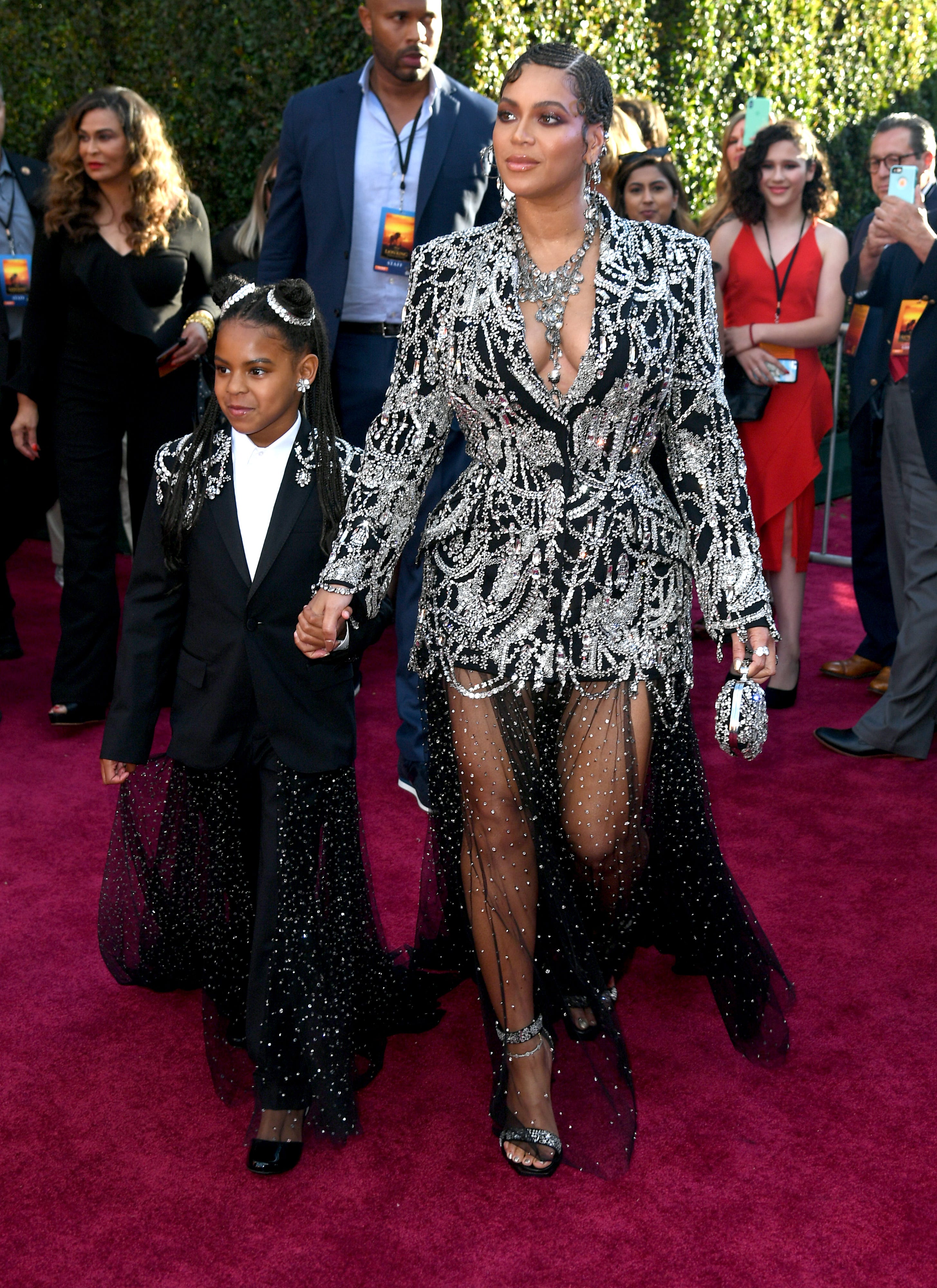 Blue Ivy Carter won her first Grammy Award in 2021 for best music video for "Brown Skin Girl," on which Blue Ivy is credited as a featured artist, making her the second-youngest person to win a Grammy. Here, the mother-daughter duo attend the premiere of Disney
