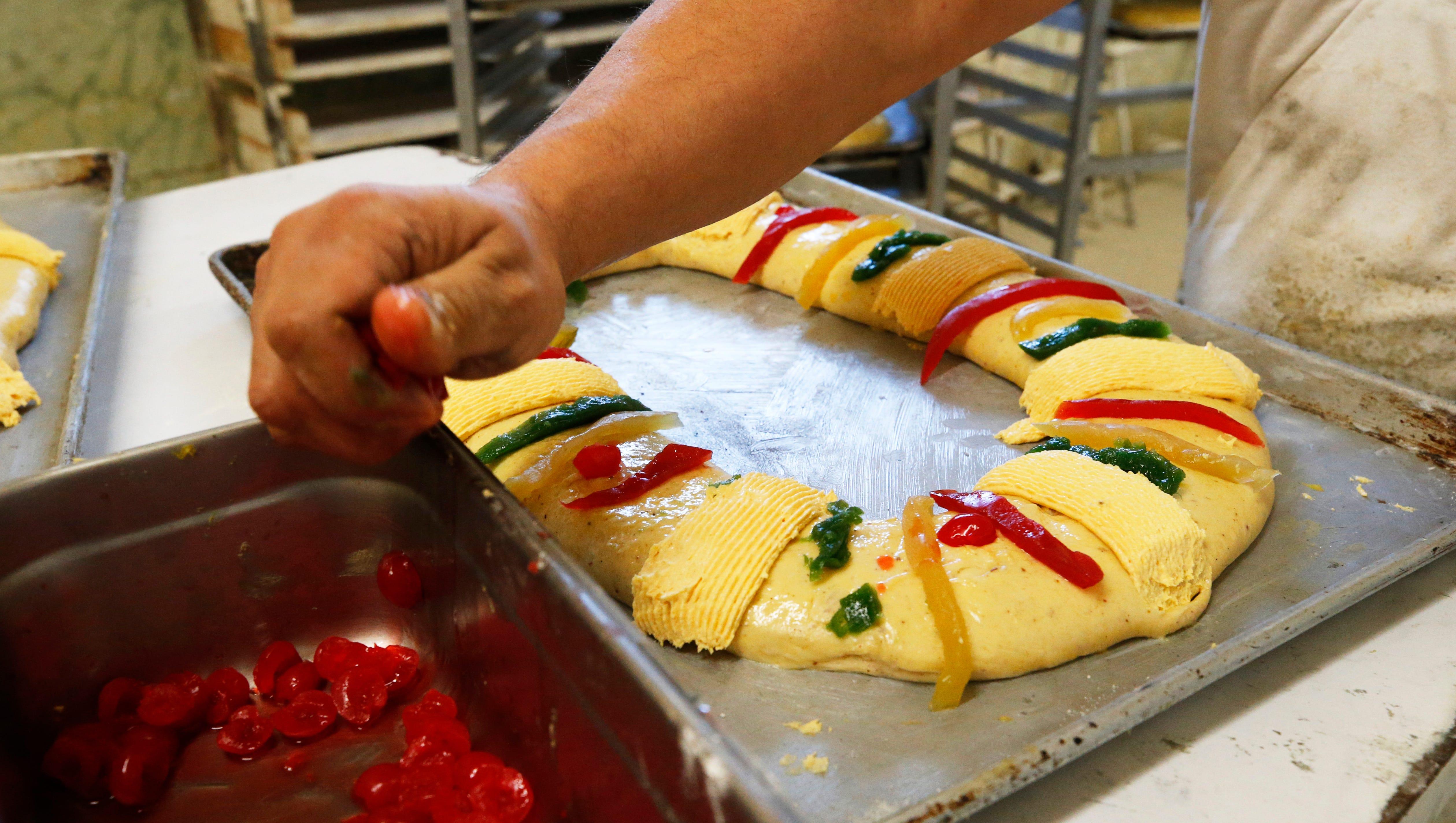 One of several bakers at El Fenix Bakery in El Paso’s lower valley puts the final touches on a Rosca De Reyes cake Friday morning, by the end of the day 300 of the holiday roscas will be made followed up by 400 on Saturday. For over thirty nine years Francisco Garcia has followed his fathers recipe and continued the family tradition of making the roscas at the family bakery.
