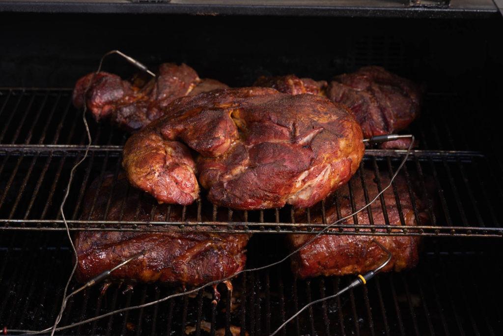 pork butts in a smoker