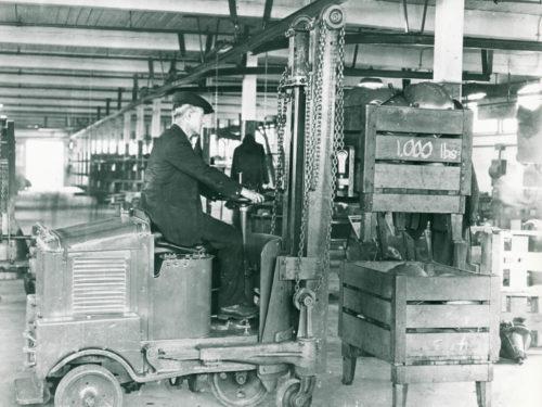 An early Elwell Parker forklift with multiple forks