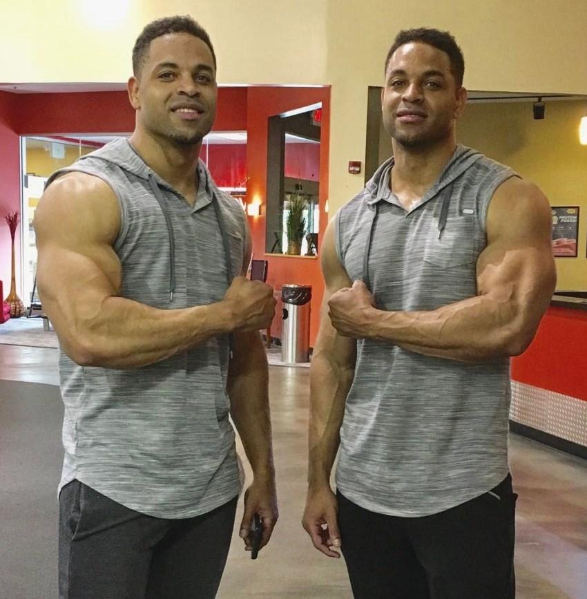 The Hodgetwins flexing their arms at the camera