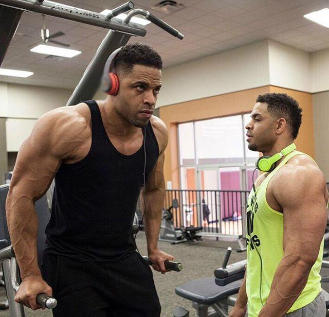 One of the Hodgetwins doing dips while the other is resting between his sets