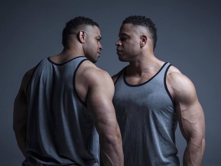 The Hodgetwins looking extremely seriously each other directly in the eyes