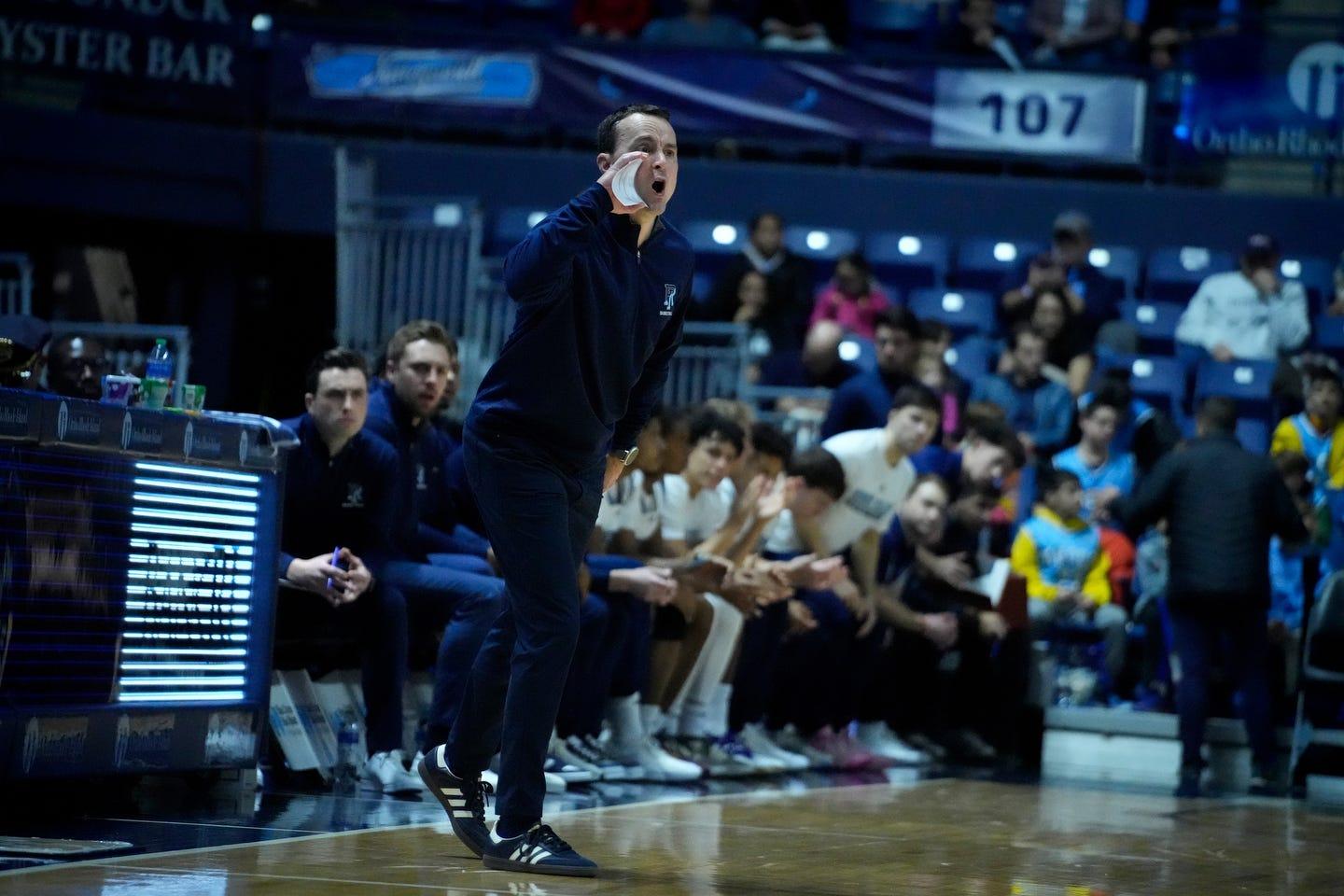 Rams coach Archie Miller yells instructions to his team from the sideline.