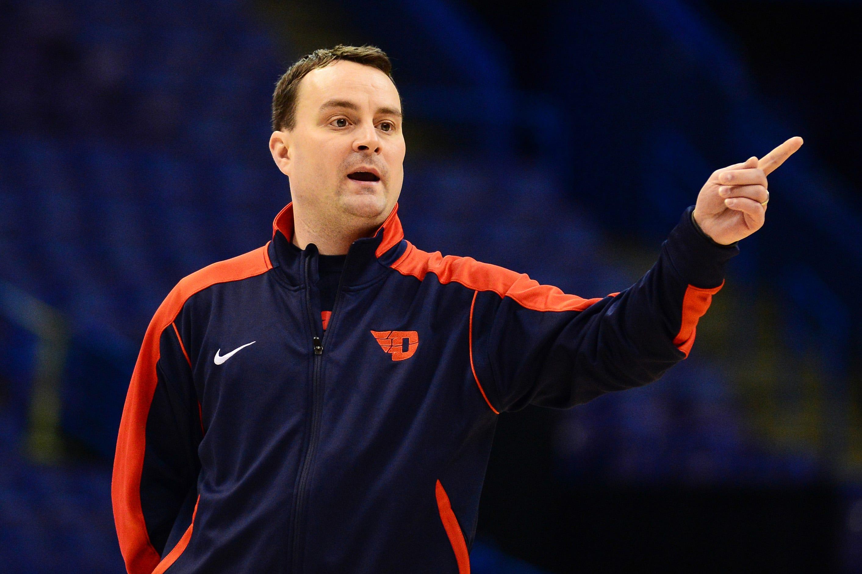 Mar 17, 2016; St. Louis, MO, USA; Dayton Flyers head coach Archie Miller talks with his team during a practice day before the first round of the NCAA men