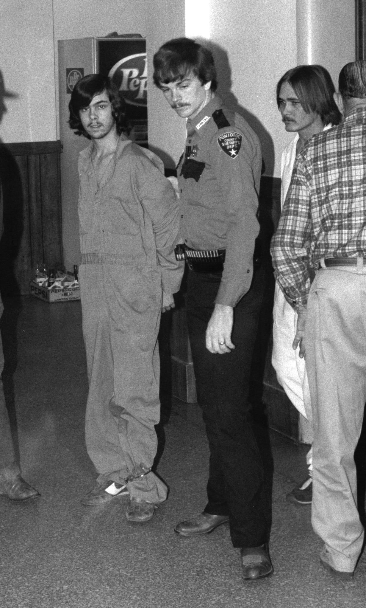 In this file photo, Karl Allen Fontenot, left, and Tommy Jesse Ward, arrive for a hearing in McAlester in 1985.