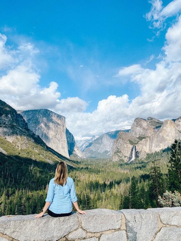 Sitting on a wall overlooking Yosemite Valley from the Wawona entrance.