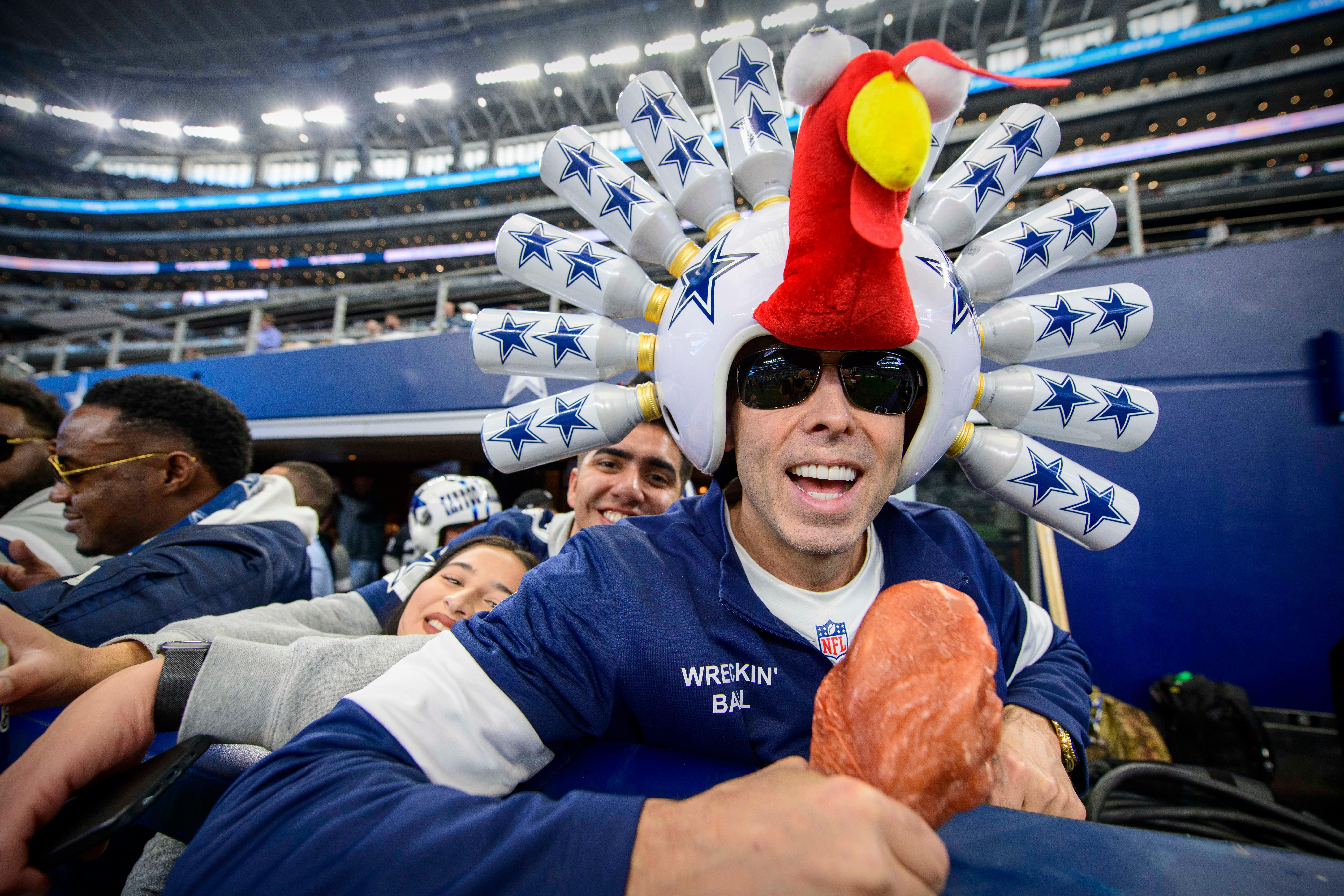 A Dallas Cowboys fan wears a turkey helmet before the Thanksgiving Day game between the Cowboys and Las Vegas Raiders at AT&T Stadium on Nov. 25, 2021.
