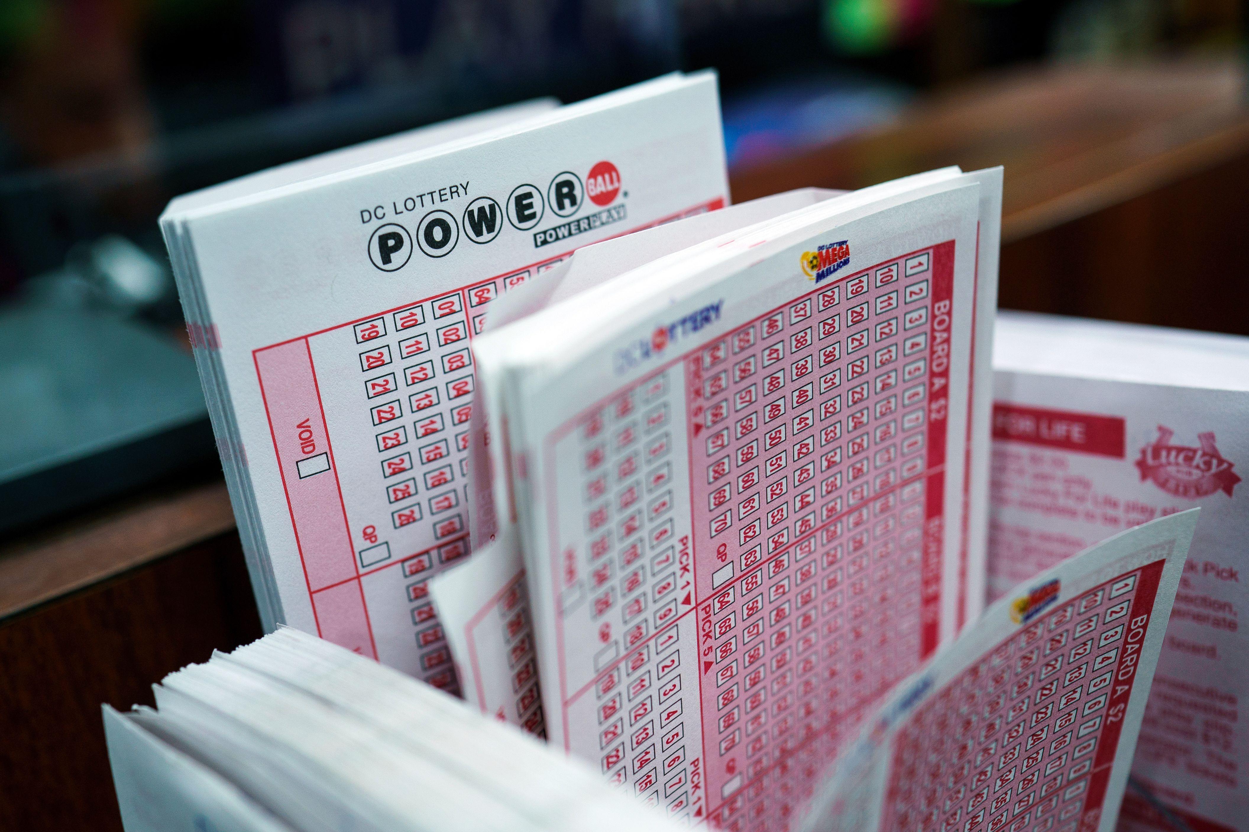 Stack of Powerball multi-state lottery tickets at a retailer in Washington, DC, announcing a jackpot of $1.09 billion on 02 April 2024