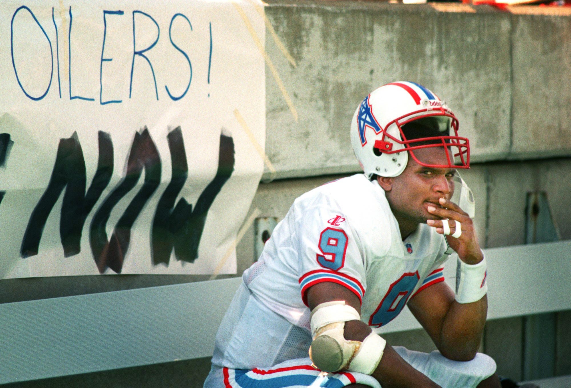 Tennessee Oilers quarterback Steve McNair sits alone on the bench as the closing seconds tick off the clock during their matchup with San Diego Chargers at Vanderbilt University’s Dudley Field on Sept. 13, 1998. The Oilers, playing their first regular season NFL game in Nashville, struggled in their 13-7 lost before a sellout crowd.