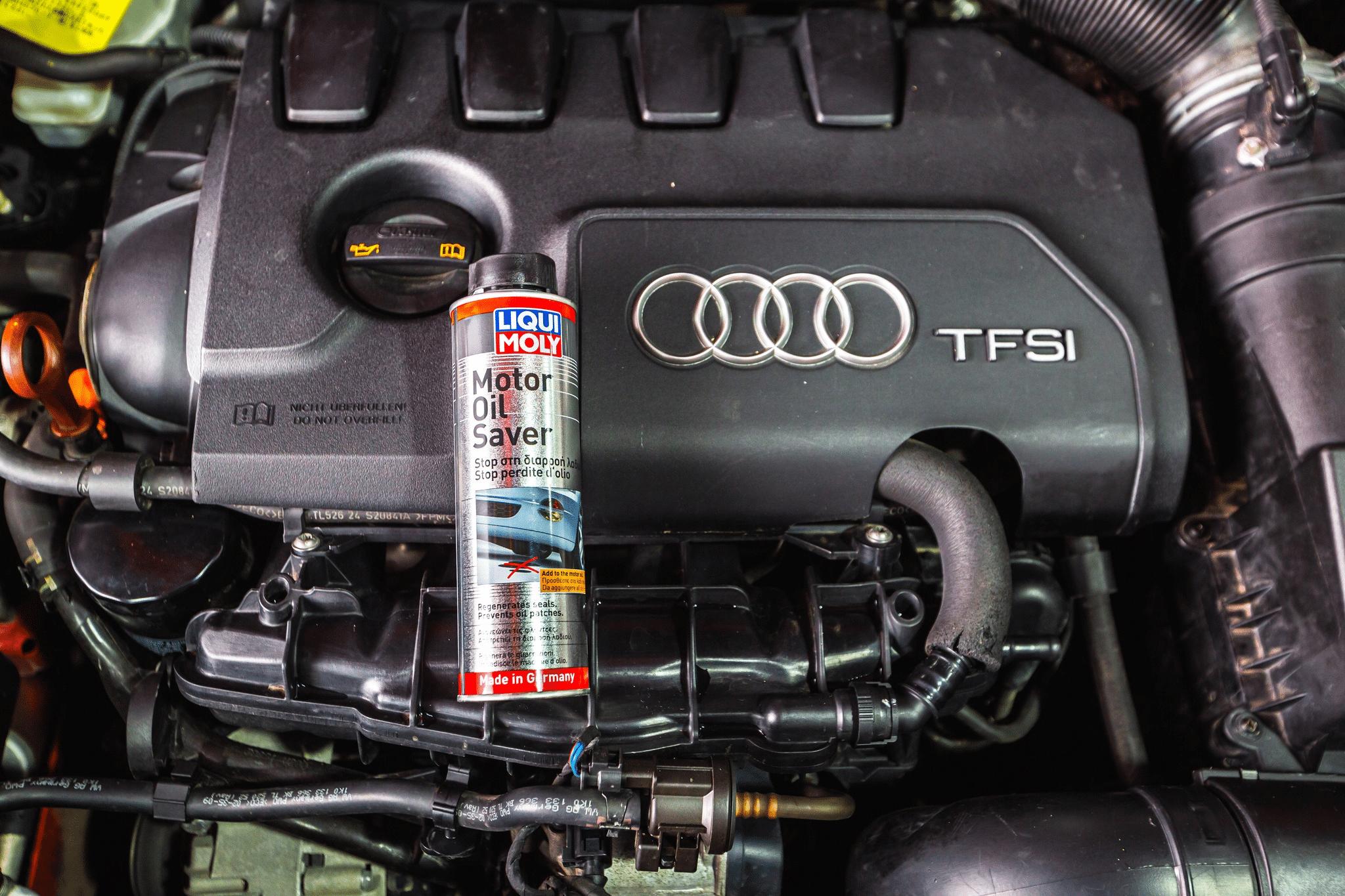 Oil additives being added to a car engine