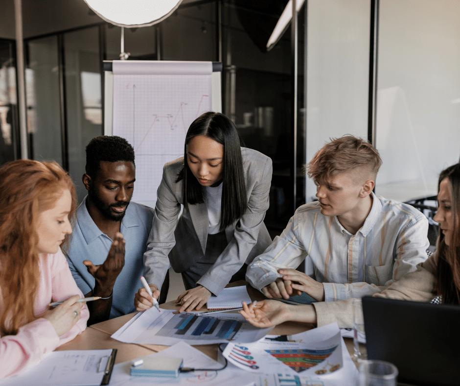 An image showing a group of employees with puzzled expressions, representing the challenge of changing organizational culture and the question of why is organizational culture so difficult to chan