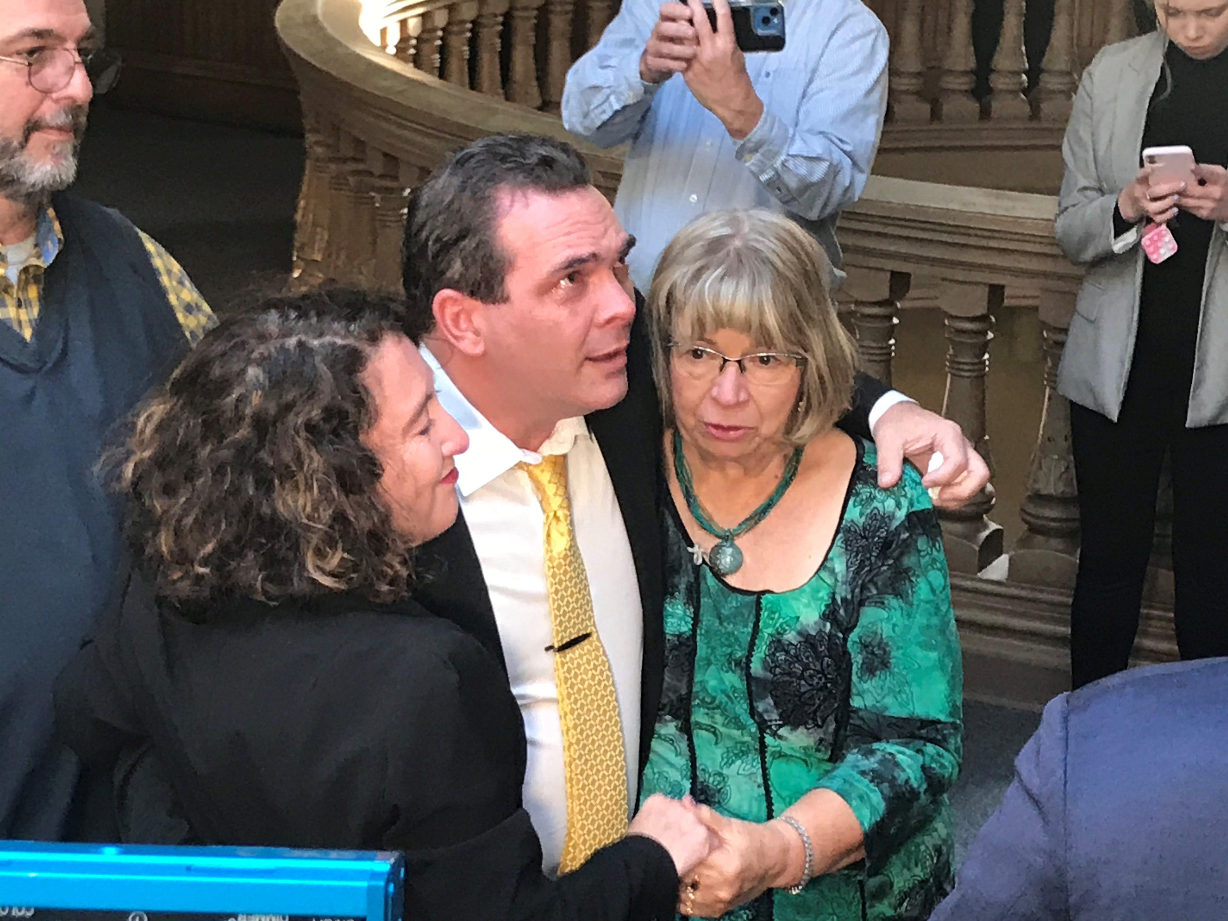 Michael Barnett flanked by his wife and mother with his father in the back wait for the elevator at the Tippecanoe County Courthouse on Oct. 27, 2022, minutes after being found not guilty of neglecting his adopted daughter, Natalia.