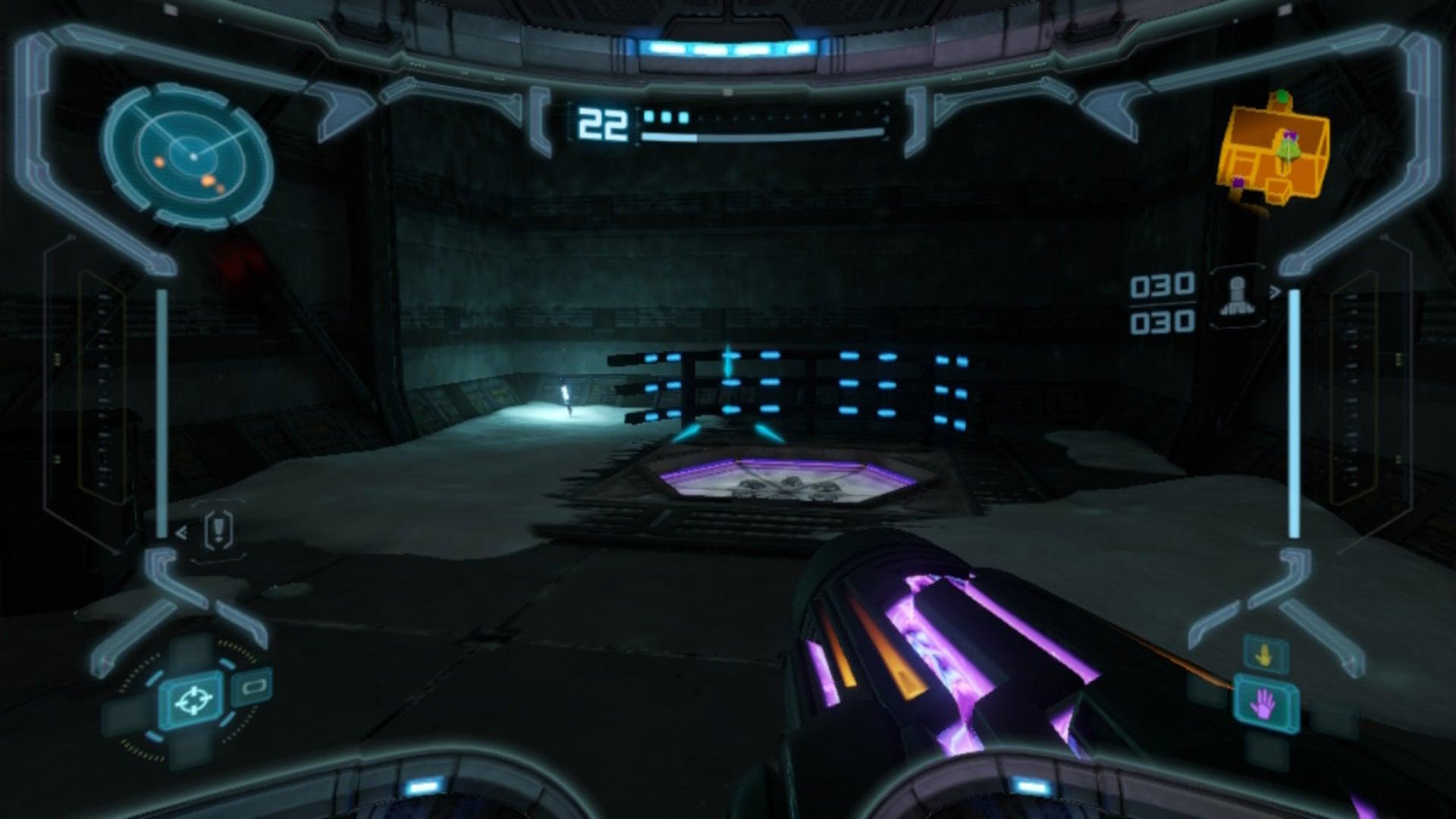 Samus looks on at a door previously obscured by crates in Metroid Prime Remastered