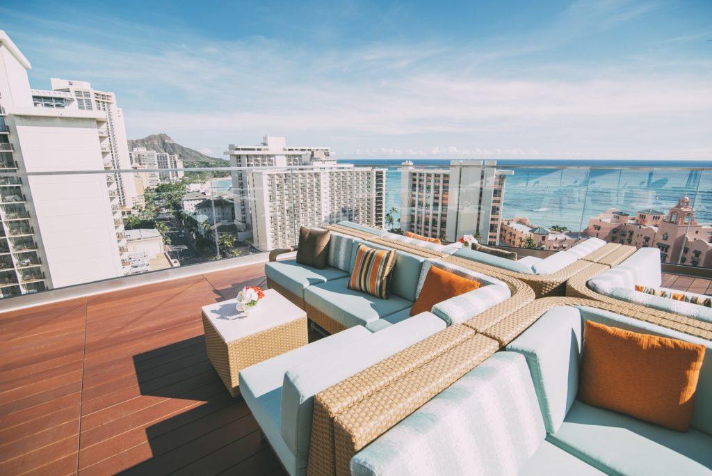 SKY Waikiki rooftop deck with a view of Diamond Head, Waikiki, and the Royal Hawaiian Pink Hotel