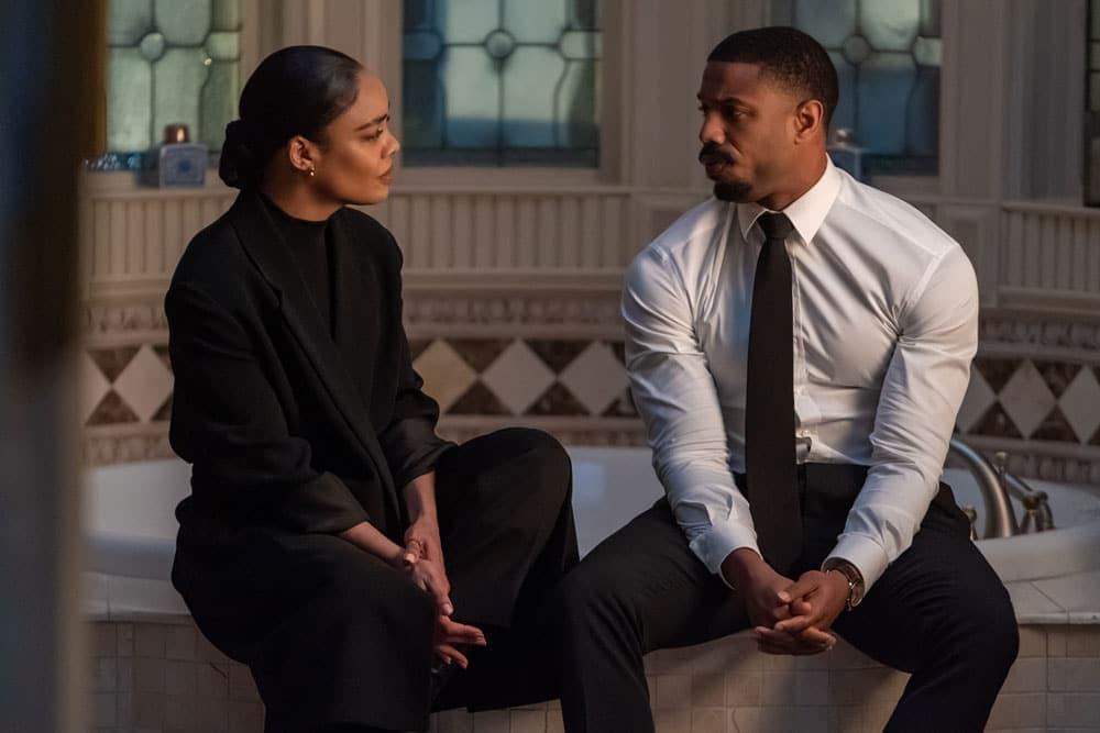 Michael B Jordan as Adonis Creed sitting next to Bianca (Tessa Thompson) sitting on a bathtub. Creed 3 parent guide.