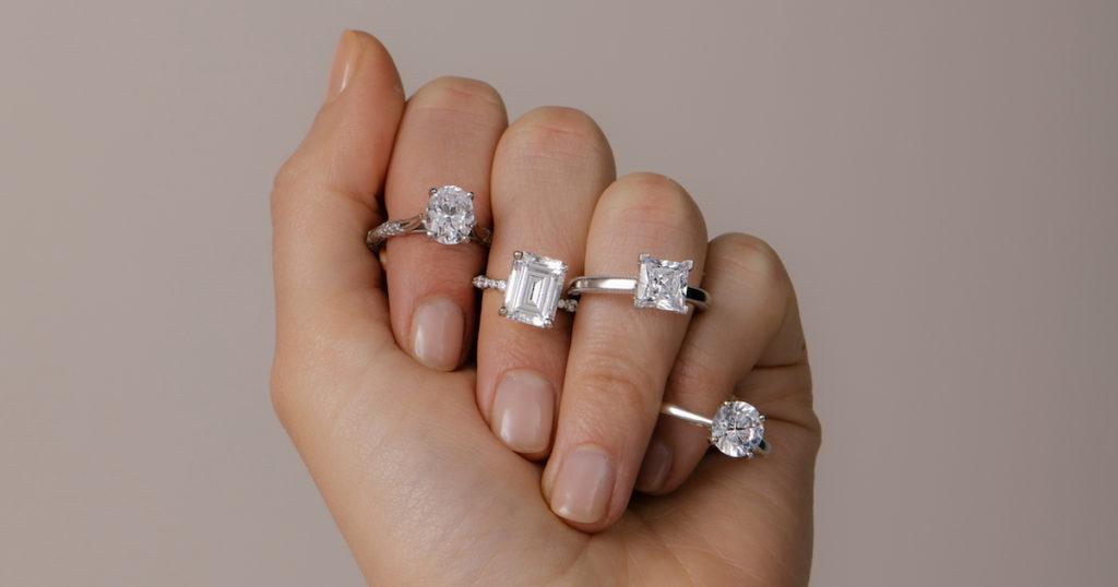 model wearing 4 diamond rings