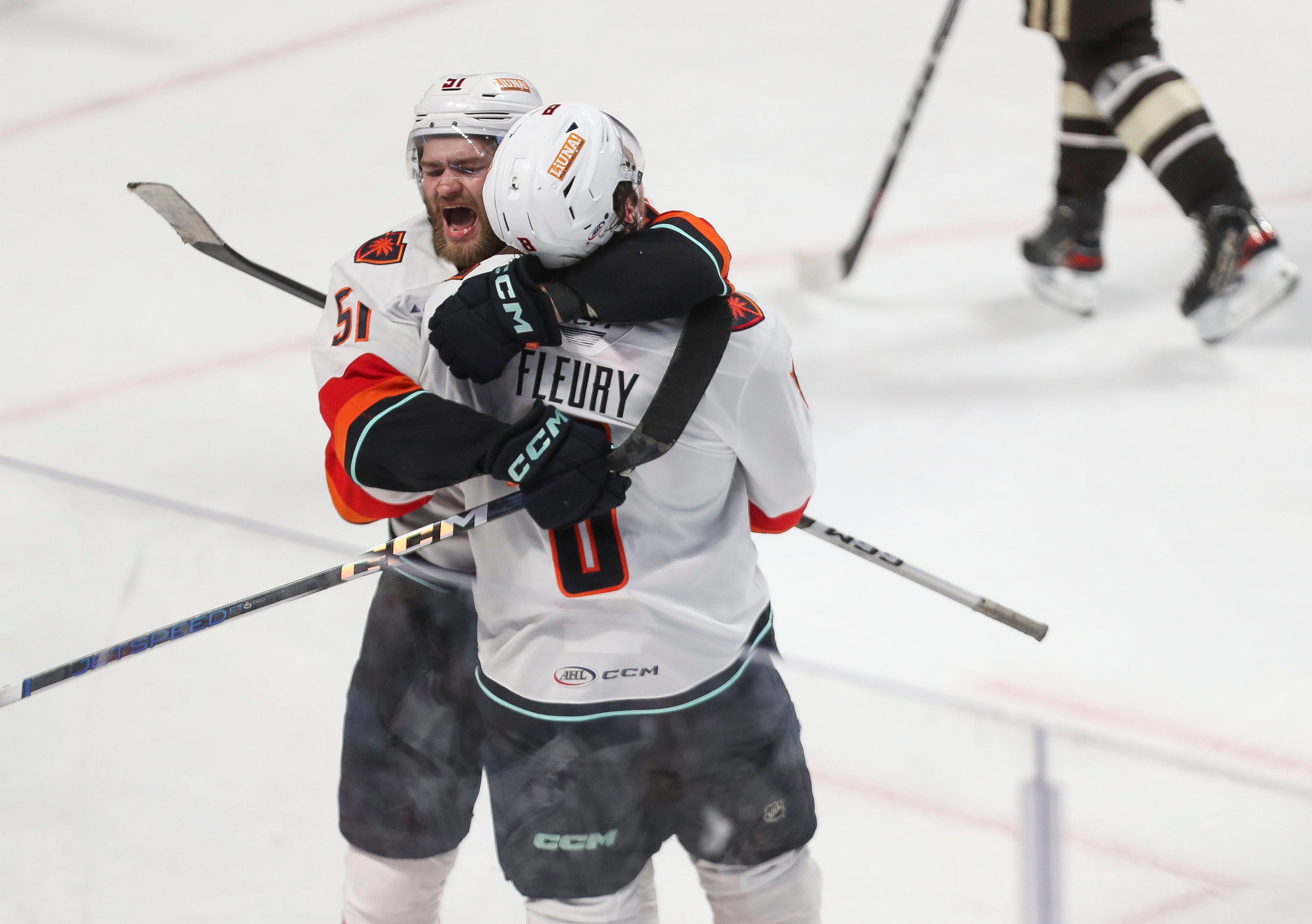 Shane Wright, 51, hugs Cale Fleury after Fleury scored the tying goal for the Coachella Valley Firebirds against the Hershey Bears during Game 6 of the AHL Calder Cup at the Giant Center in Hershey, Pa., June 24, 2024.