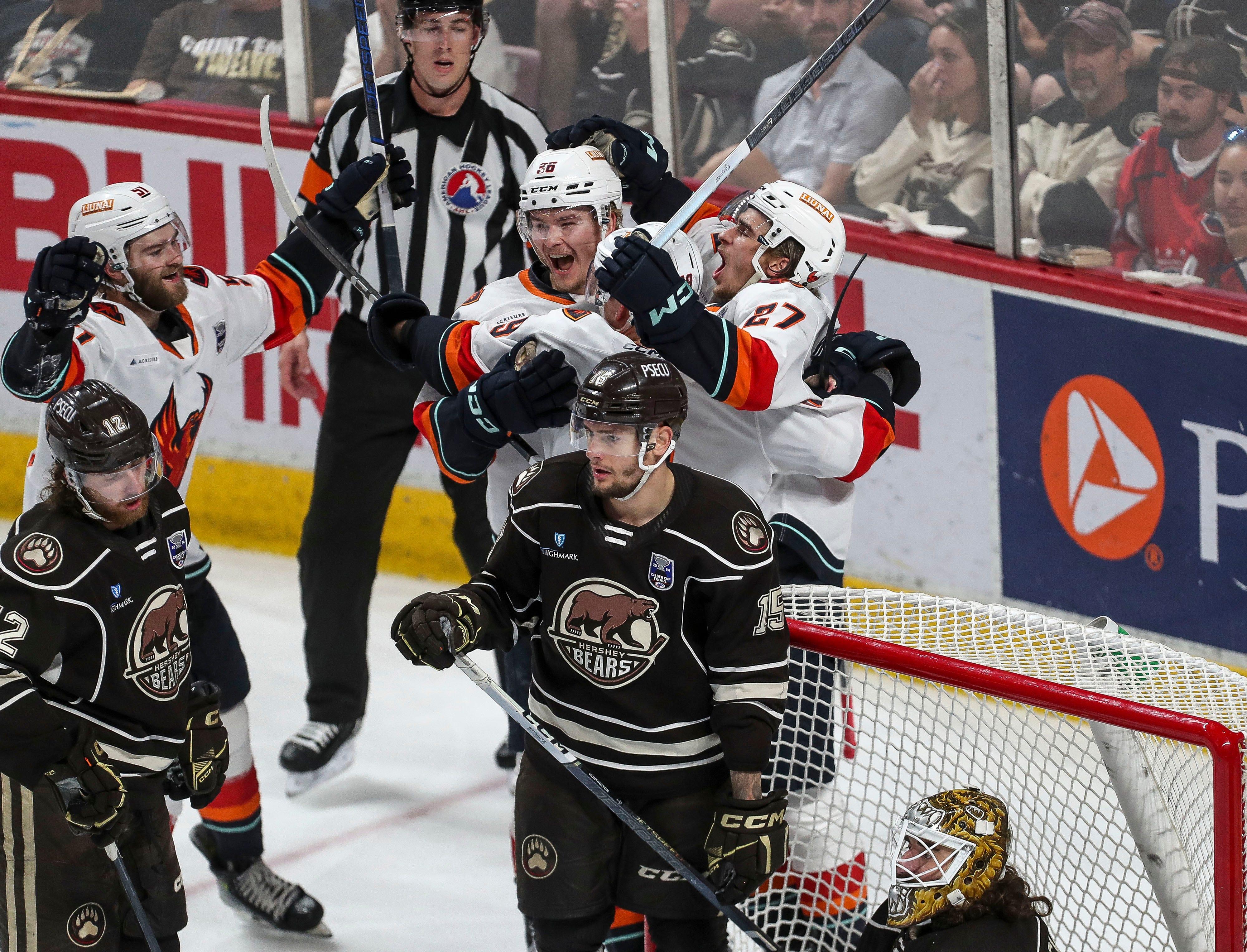 The Coachella Valley Firebirds celebratre their third goal against the Hershey Bears during Game 6 of the AHL Calder Cup at the Giant Center in Hershey, Pa., June 24, 2024.