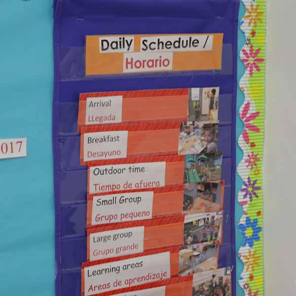A schedule posted to a wall inside a daycare room