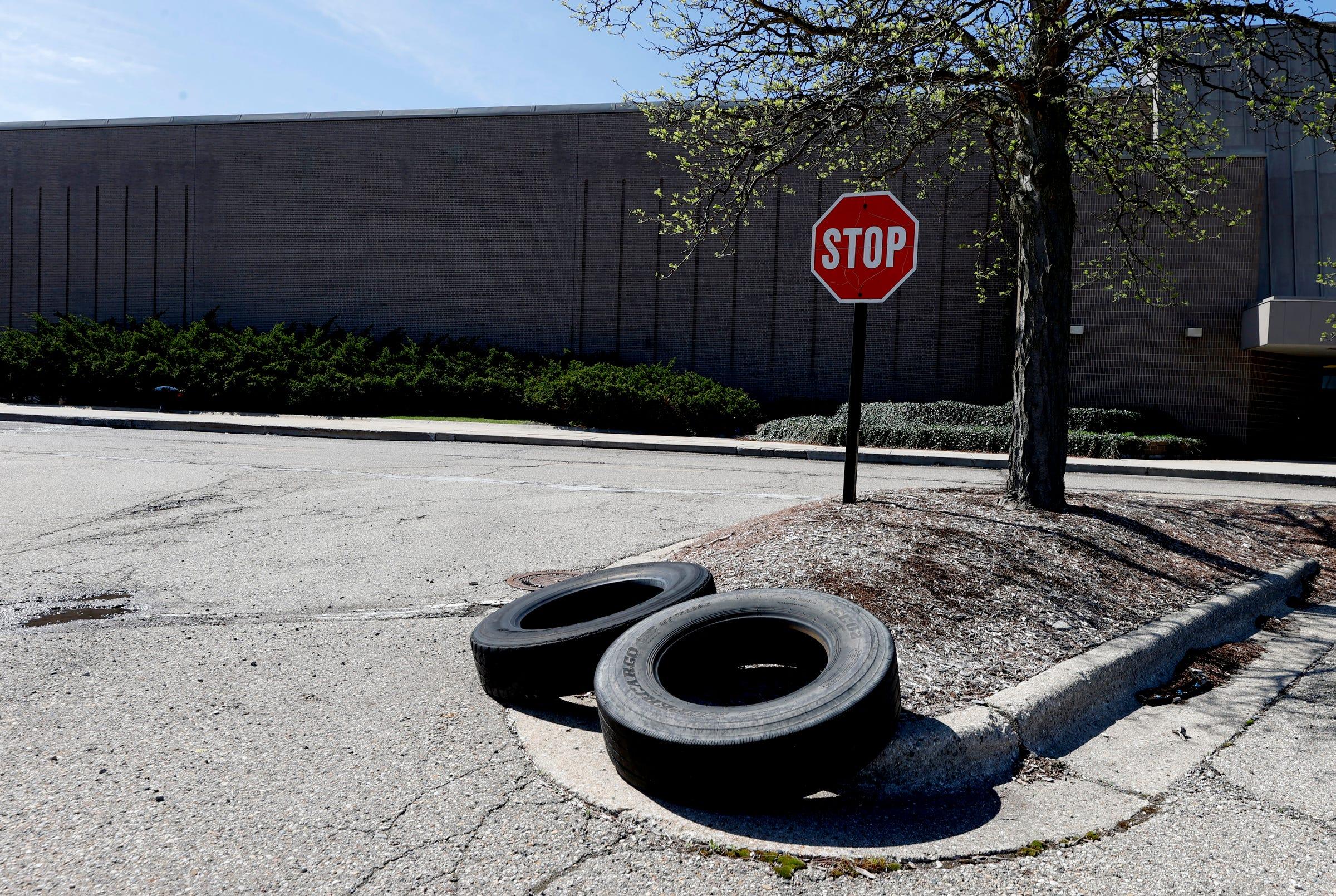 Large tires in the parking lot of Lakeside Mall in Sterling Heights on Tuesday, April 30, 2024. The tenants inside are being told they have to move out by July 1, 2024, as the longtime mall is closing. The site will be redeveloped as a mixed-use project.