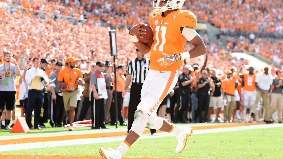 Tennessee quarterback Joshua Dobbs (11) jogs into the end zone for a touchdown against Northwestern during the first half of the Outback Bowl on Jan. 1, 2016.