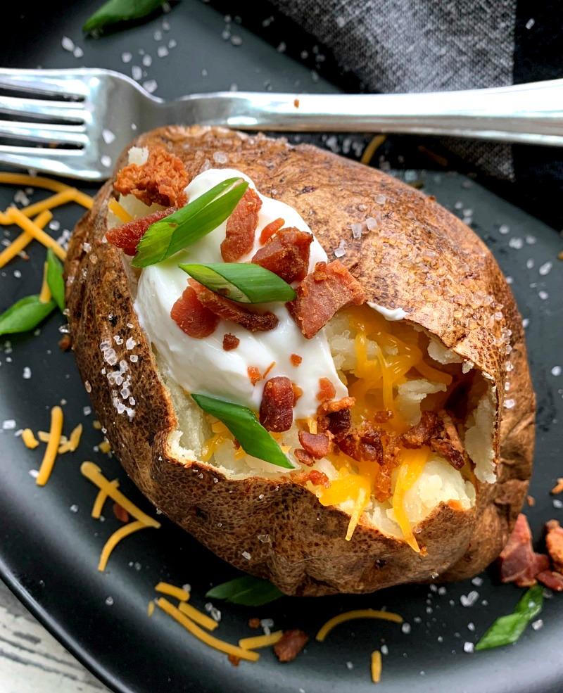 overhead view - loaded air fryer bakes potatoes