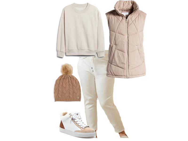 Tan puffer vest with white joggers and sweatshirt, shearling sneakers, and a camel colored beanie