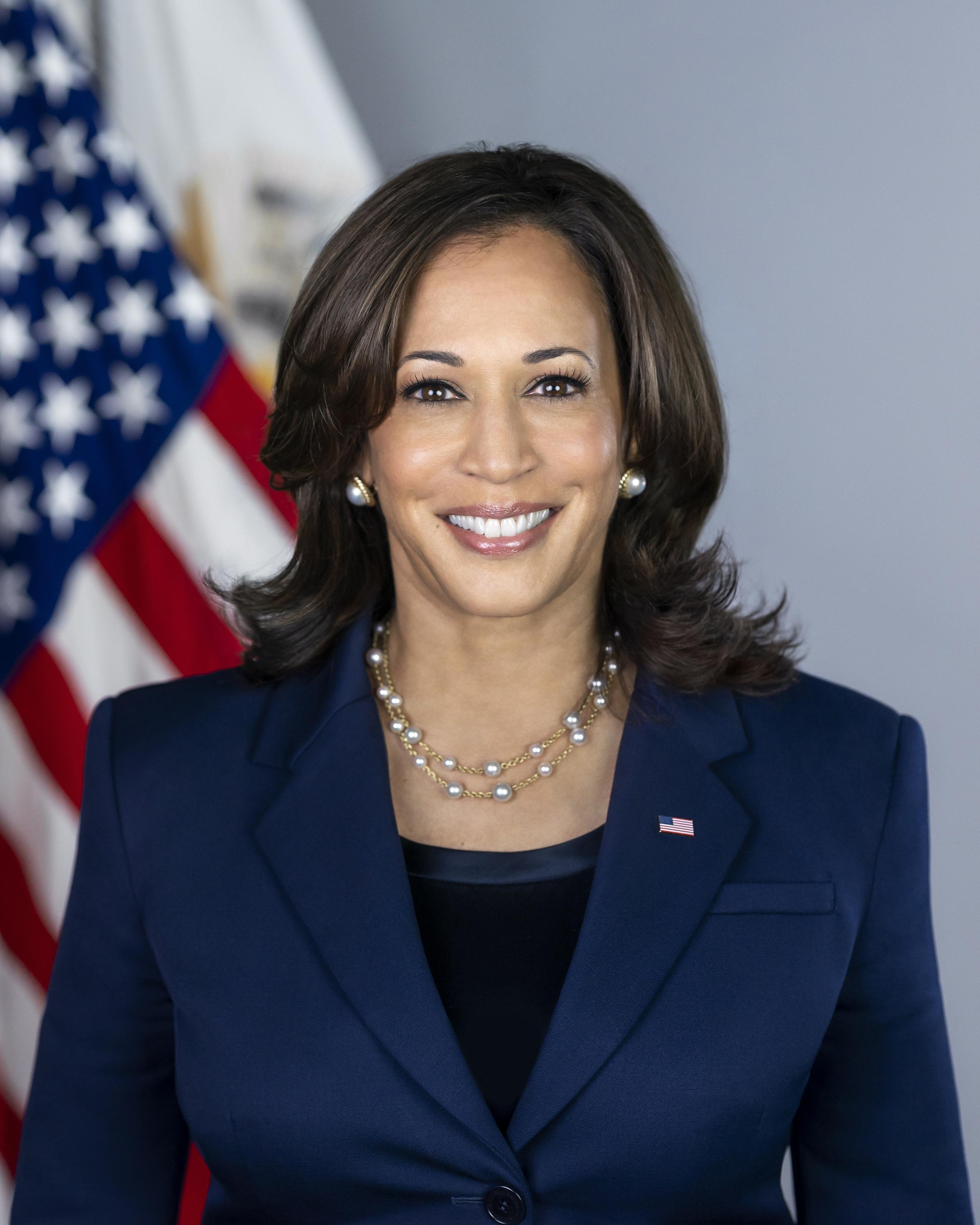 Vice President Harris smiles at a crowd at the Pride Parade in San Francisco, CA, accompanied with her husband, Doug, and her niece, Meena