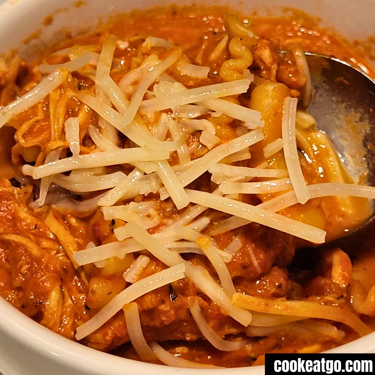 Crockpot Chicken parmesan Soup cooked and served in a white bowl